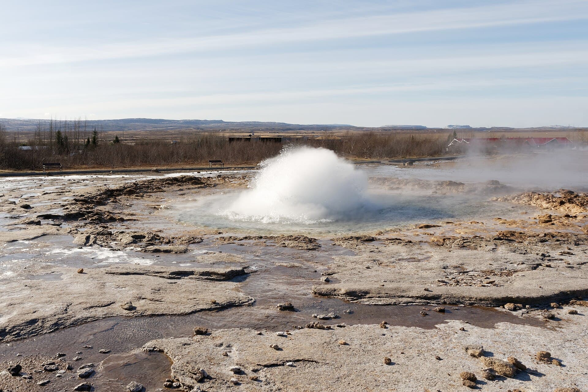 Strokkur geyser bursting from its pool in the Geysir geothermal area